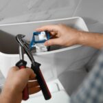 homeowner attempting to fix plumbing issue with constantly running toilet