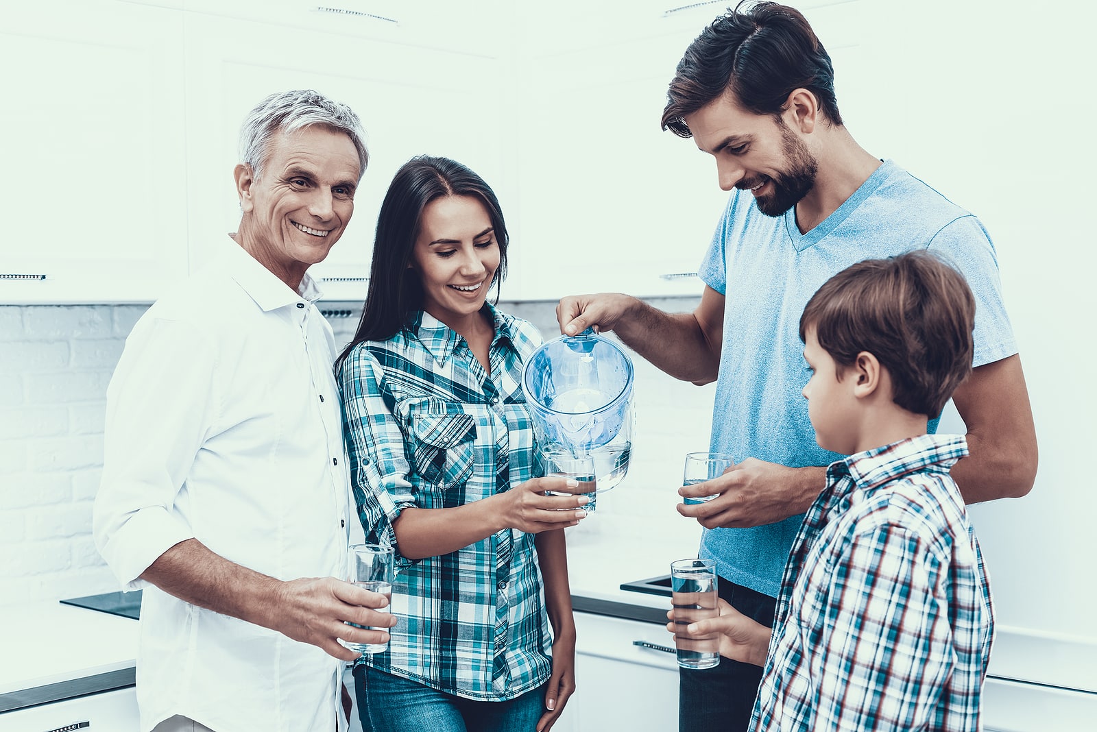 Family members drink water knowing that it is safe thanks to their backflow preventer limiting contaminants.